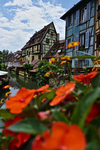 View of canal and buildings against sky