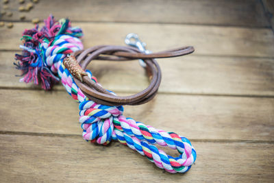 High angle view of multi colored tied on wooden table