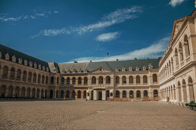 Inner courtyard of the les invalides palace with old cannons in paris. the famous capital of france.