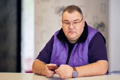 Portrait of young man using mobile phone