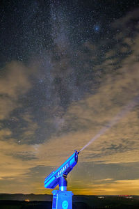 Windmill against sky at night