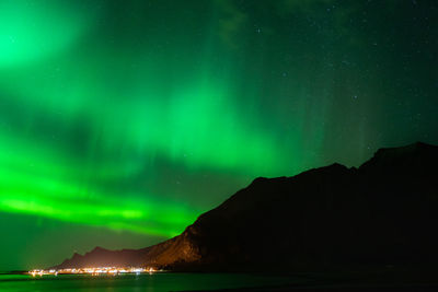 Scenic view of mountains against sky at night