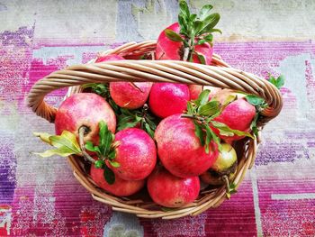 High angle view of strawberries in basket on table