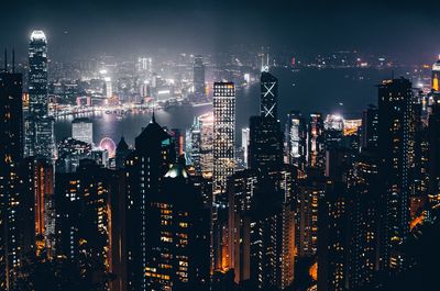 Illuminated victoria harbour at night