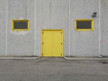 Yellow closed door of building