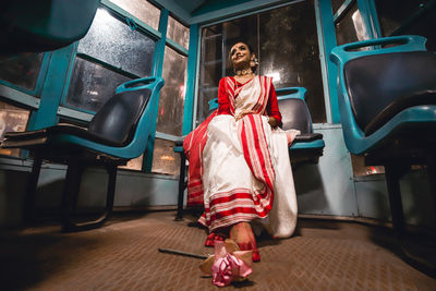 Portrait of woman sitting on seat