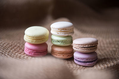 Close-up of colorful macaroon on burlap