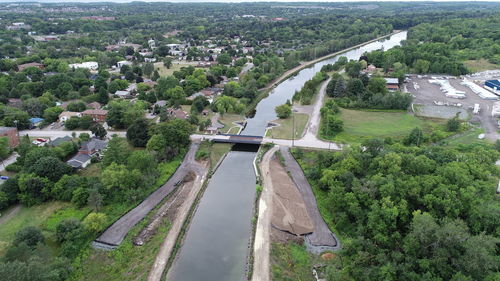 High angle view of road amidst trees in city