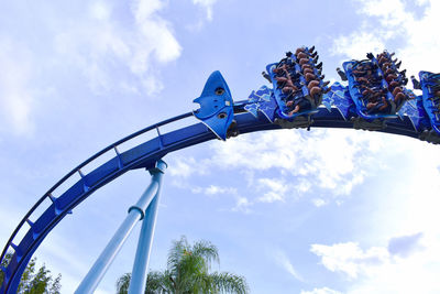 Low angle view of rollercoaster against sky