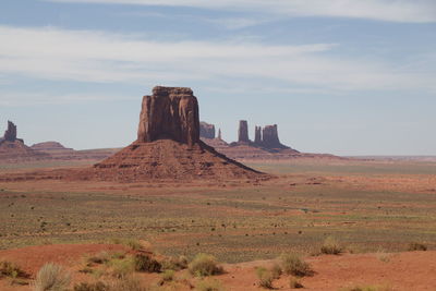 Rock formations on landscape against sky