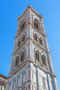 Low angle view of building against blue sky