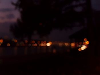 Defocused image of illuminated lights at night