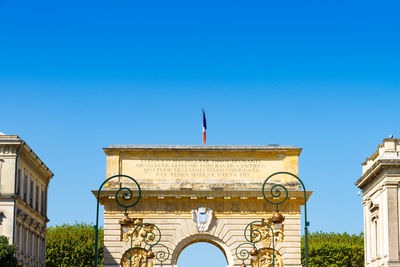 Low angle view of historical building against blue sky