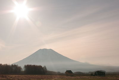 Scenic view of landscape and mountains against sky