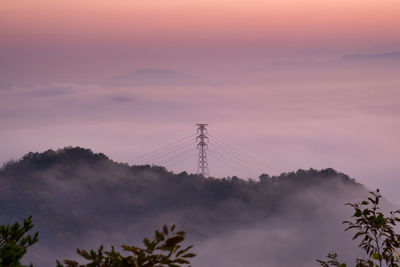 A pylon under the morning fog