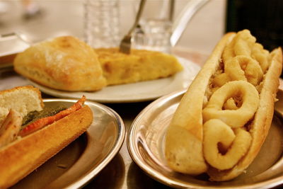 Close-up of various snacks served on table