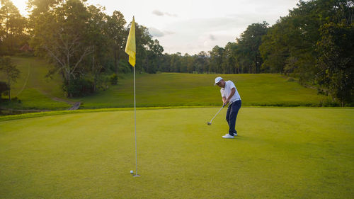 Man playing golf