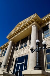 Low angle view of building against clear blue sky