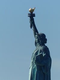 Statue of liberty against blue sky