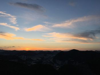 Silhouette landscape against scenic sky