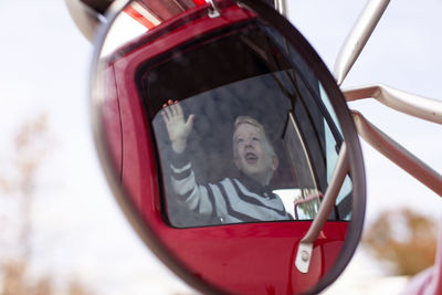 Portrait of man in car window