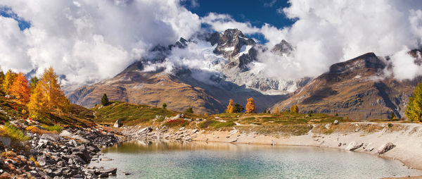 Panoramic view of lake and mountains against sky