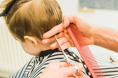 Boy getting haircut