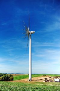 Wind turbines in field