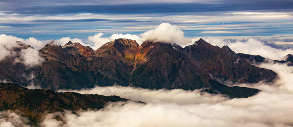 Scenic view of snowcapped mountains against sky