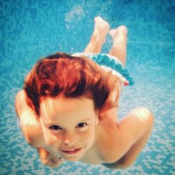 High angle portrait of baby boy in swimming pool