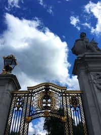 Low angle view of statue against cloudy sky