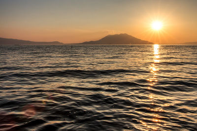 Seascape against sky during sunset