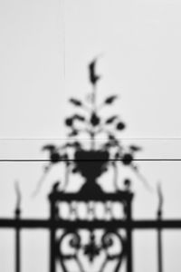 Close-up of metal fence against clear sky