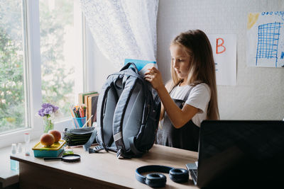 Back to school, schoolchildren hygiene, safety precautions after coronavirus. the schoolgirl 