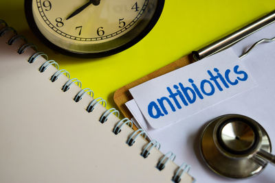 High angle view of clock on table