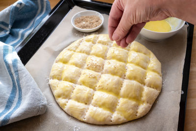 Midsection of person preparing food on table