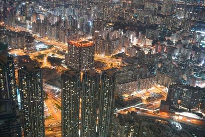 High angle view of illuminated buildings in city at night