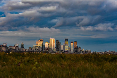 Buildings in city against sky