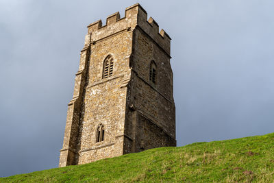 Low angle view of old building against sky