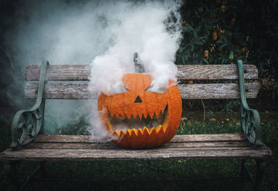 Carved pumpkin emitting smoke