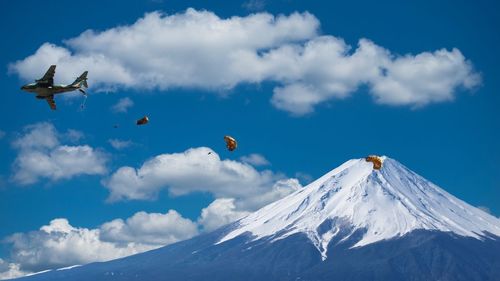 Low angle view of snowcapped mountain against sky