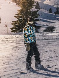 Man standing on snow covered land