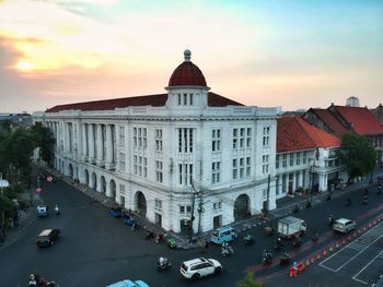 High angle view of buildings in city against sky during sunset