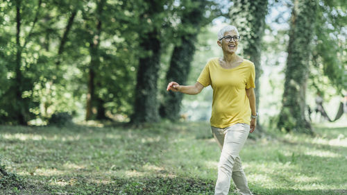 View of mature woman walking at park