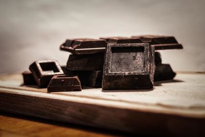 Close-up of rusty stack on table