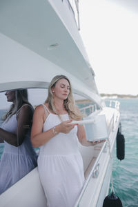 Portrait of young woman in boat