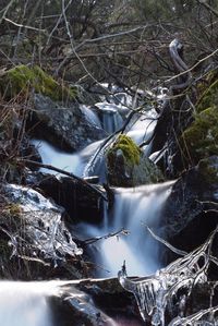 Scenic view of waterfall on landscape