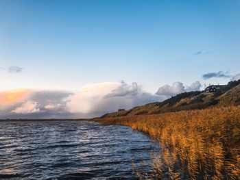 Scenic view of sea against sky during sunset