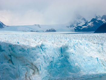 Scenic view of frozen lake against sky