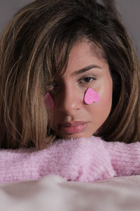 Close-up of young woman with eyes closed